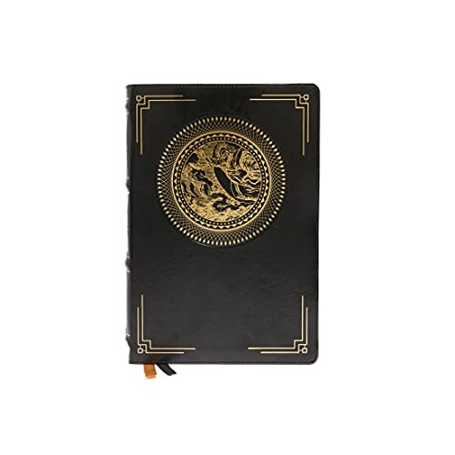 Black leather journal with gold dragon emblem on cover