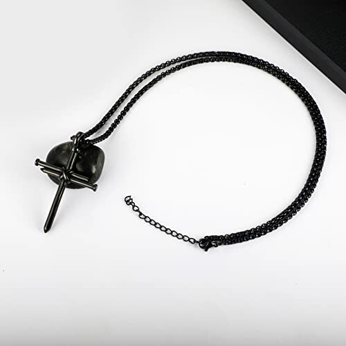 Black skull cross necklace on a chain