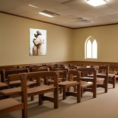 Empty church interior with wooden pews and a wall painting.