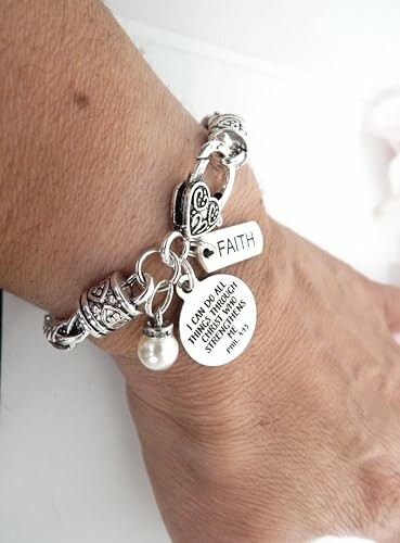 Silver bracelet with faith charm and pearl.