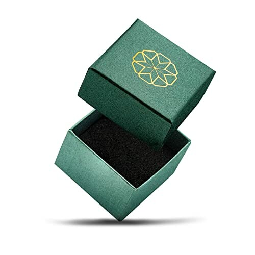 Open green gift box with gold geometric design