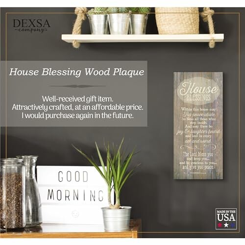 Wooden plaque with a house blessing on a wall shelf.