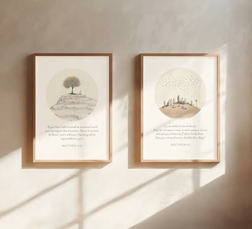 Two framed posters with minimalist design and quotes on a wall.