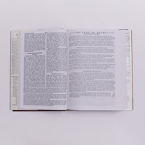 Open book showing pages with religious text.