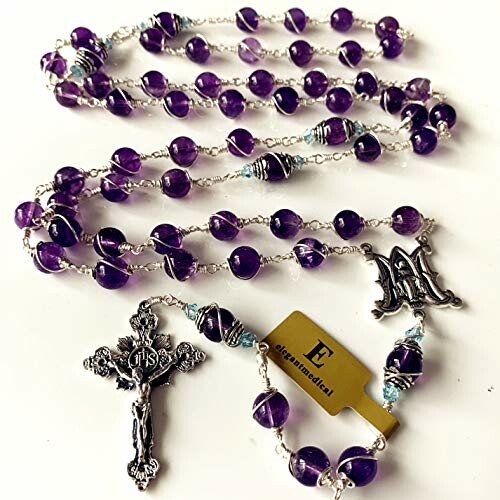 Purple rosary beads with silver crucifix and charm.
