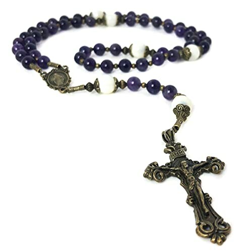 Rosary beads with purple and white stones and a crucifix.