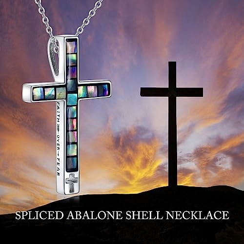 Spliced abalone shell cross necklace with sunset background.
