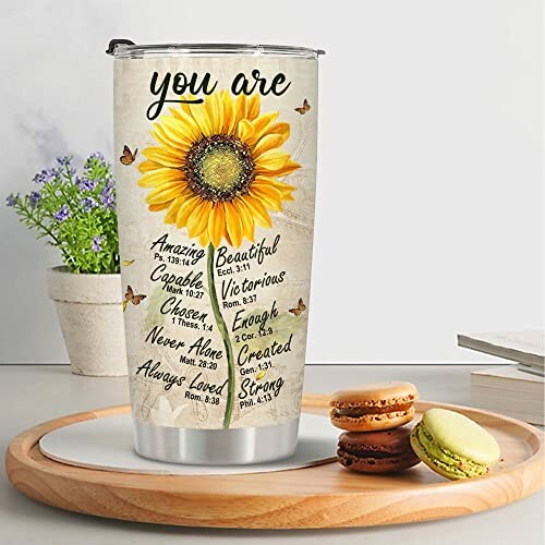 Inspirational tumbler with sunflower design and motivational phrases.
