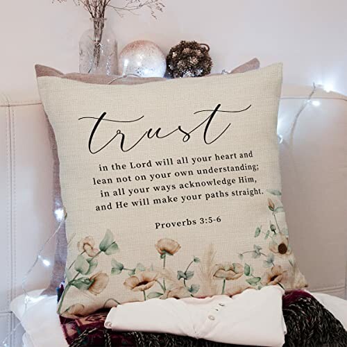 Decorative pillow with Proverbs 3:5-6 quote and floral design