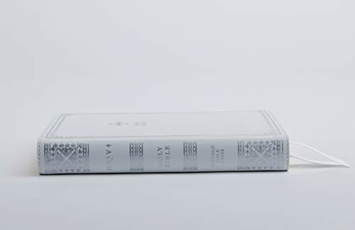 Side view of a white Holy Bible with a ribbon bookmark.