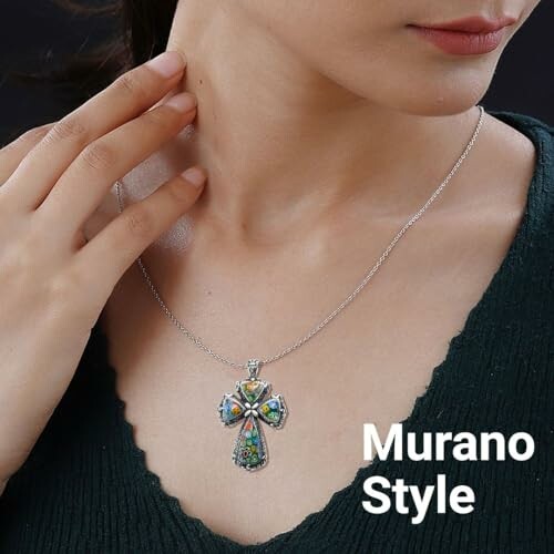 Woman wearing Murano style cross necklace.