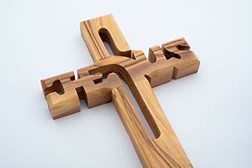 Wooden cross with the word Jesus carved out
